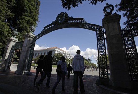 A group walks through the Sather Gate on the University of California, Berkeley campus in Berkeley, Calif. For a one-time hotbed of protest, this liberal college town is pretty chill these days. You're more likely to hear rumblings about the latest in the food revolution than people power.